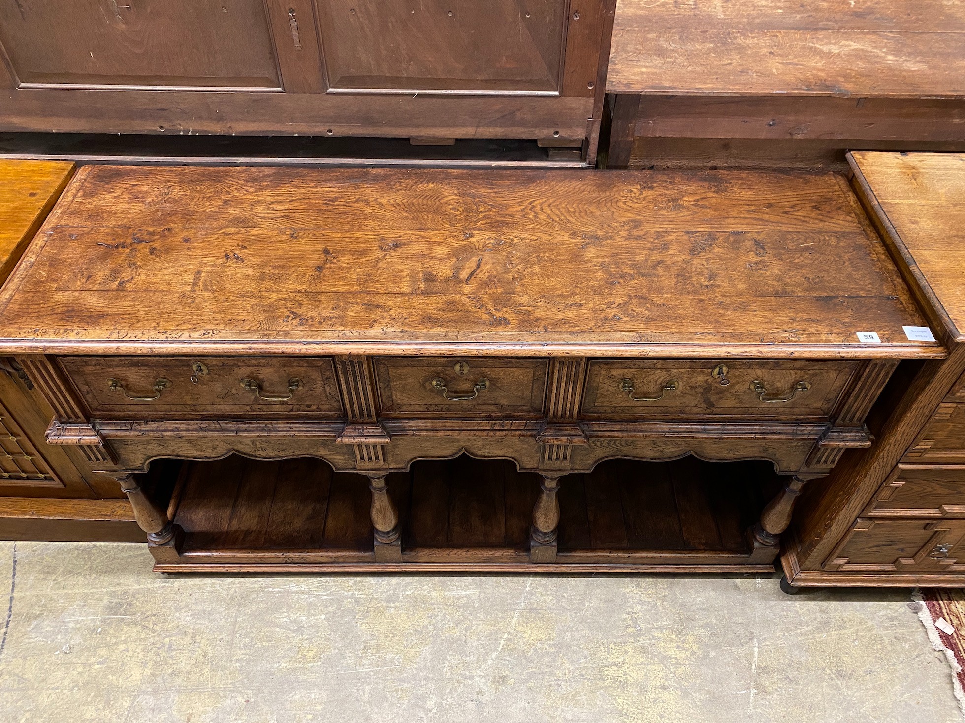 An early 18th century style banded burr oak low pot-board dresser, width 152cm, depth 49cm, height 84cm